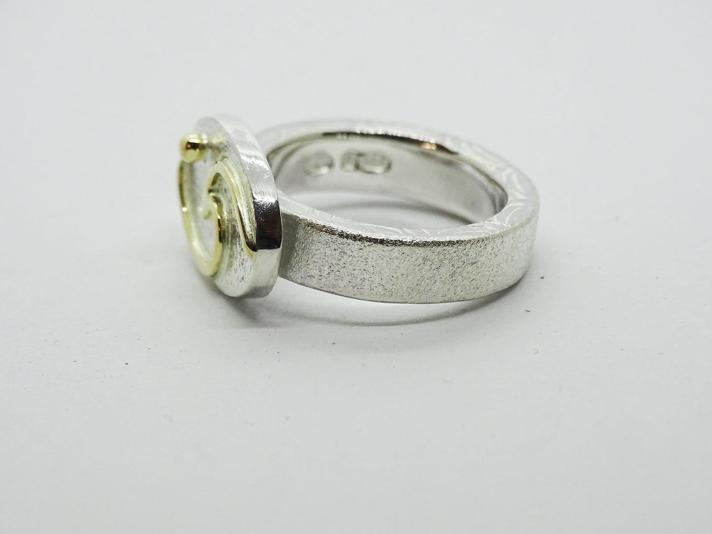 Wave with moon ring.