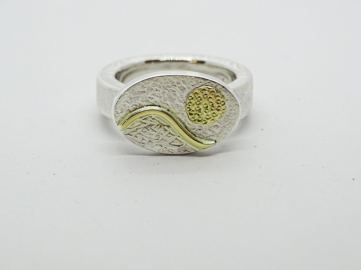 Mountain with sun ring.