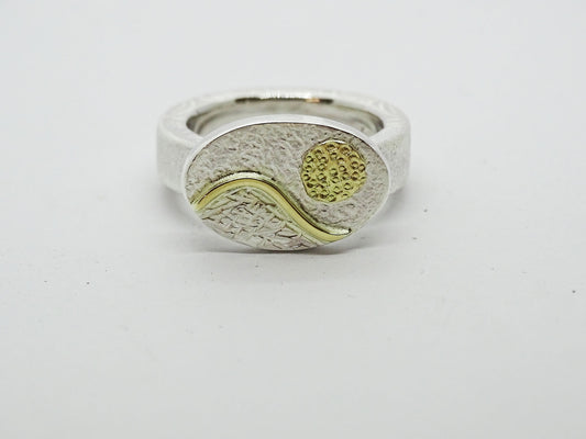 Mountain with sun ring.