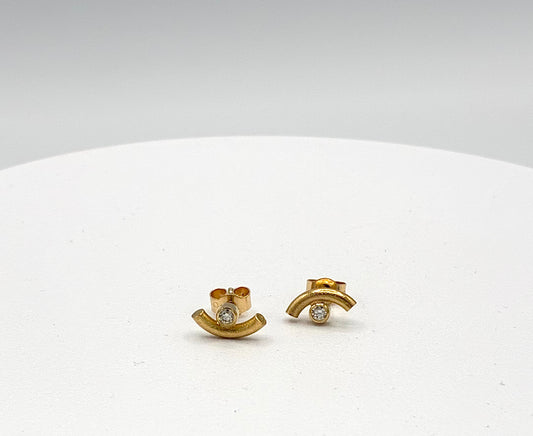 Studs. Curve and diamond.