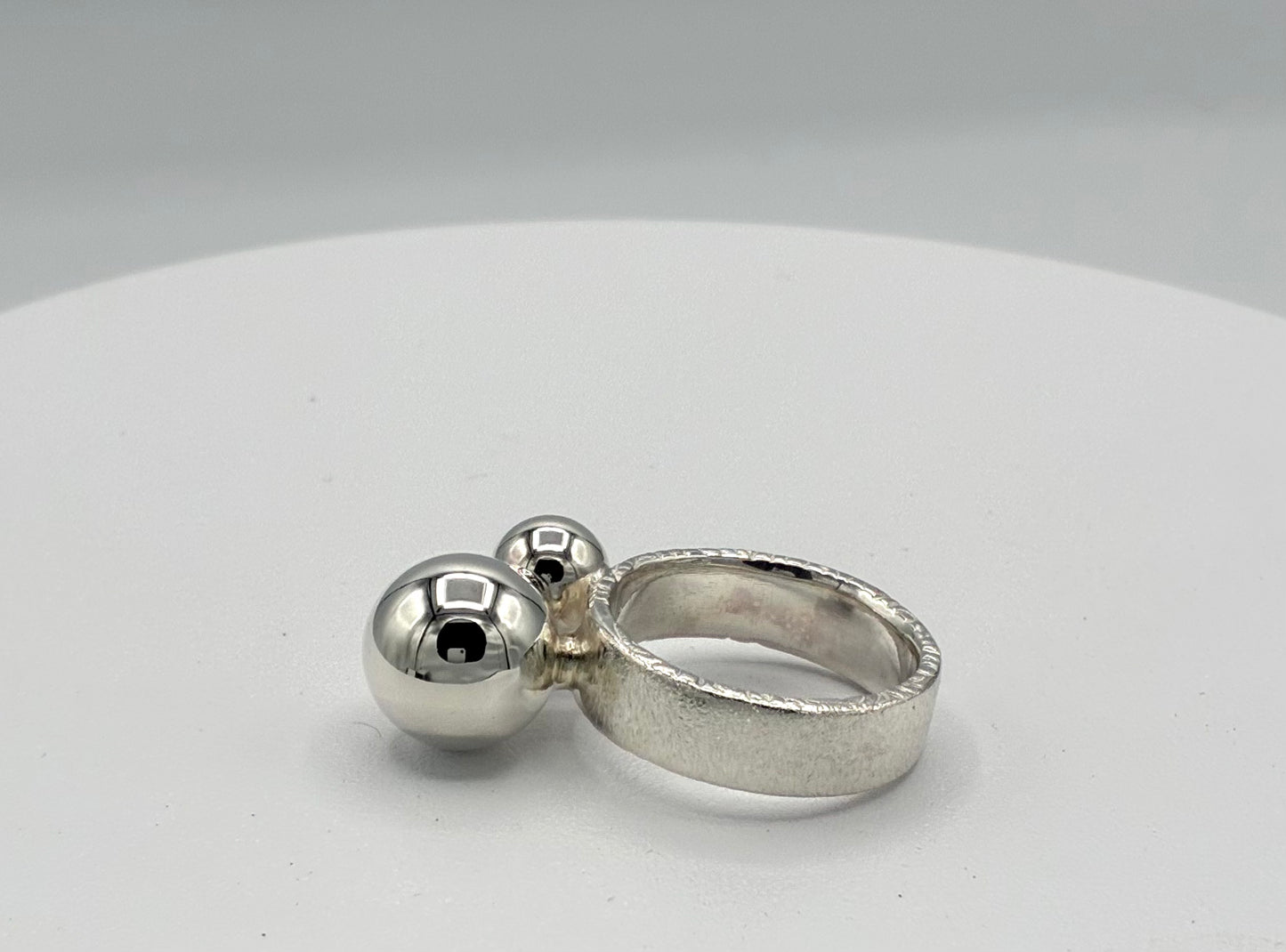 Ring. Two Balls.