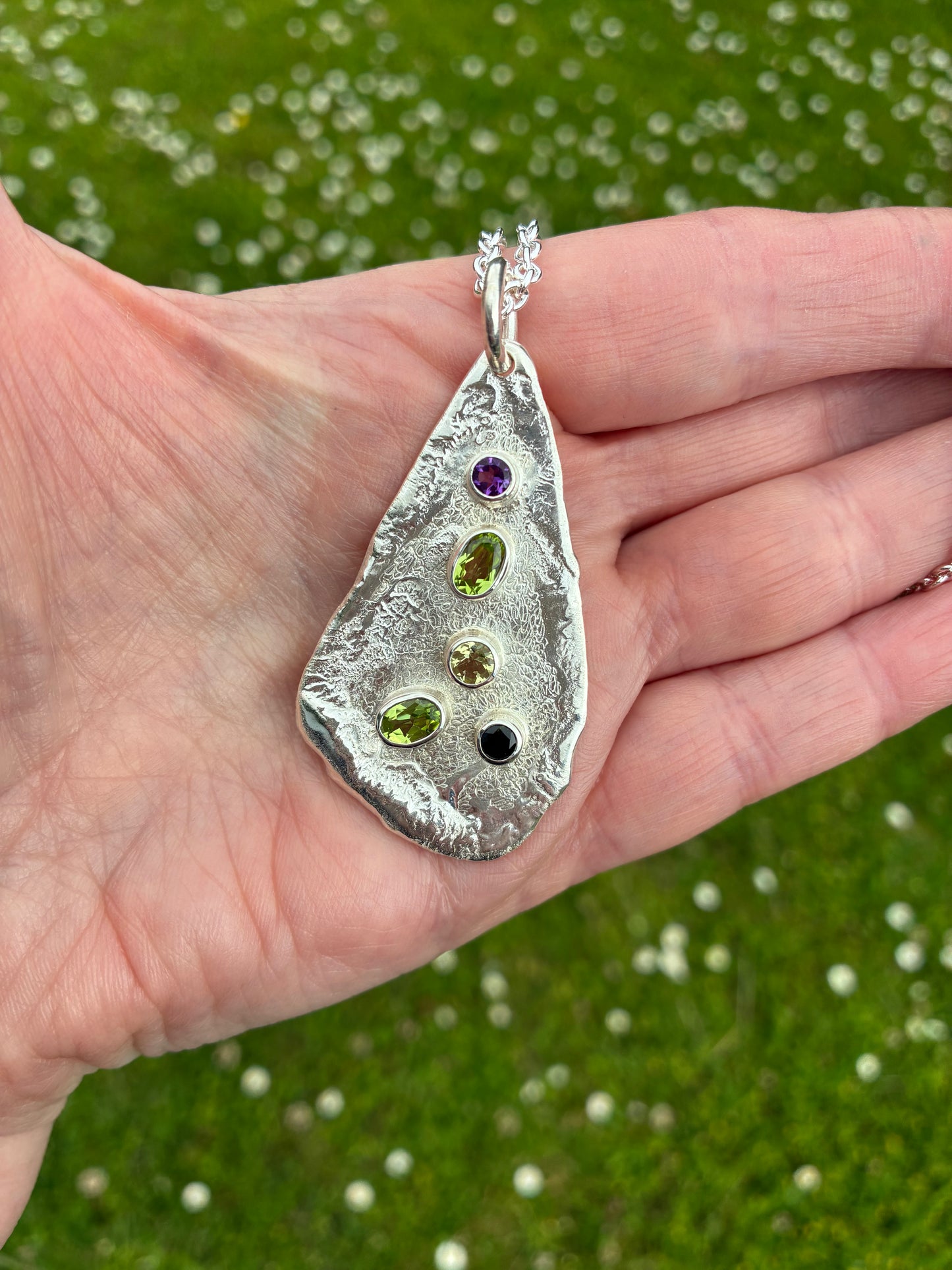 Pendant. Five stone long.