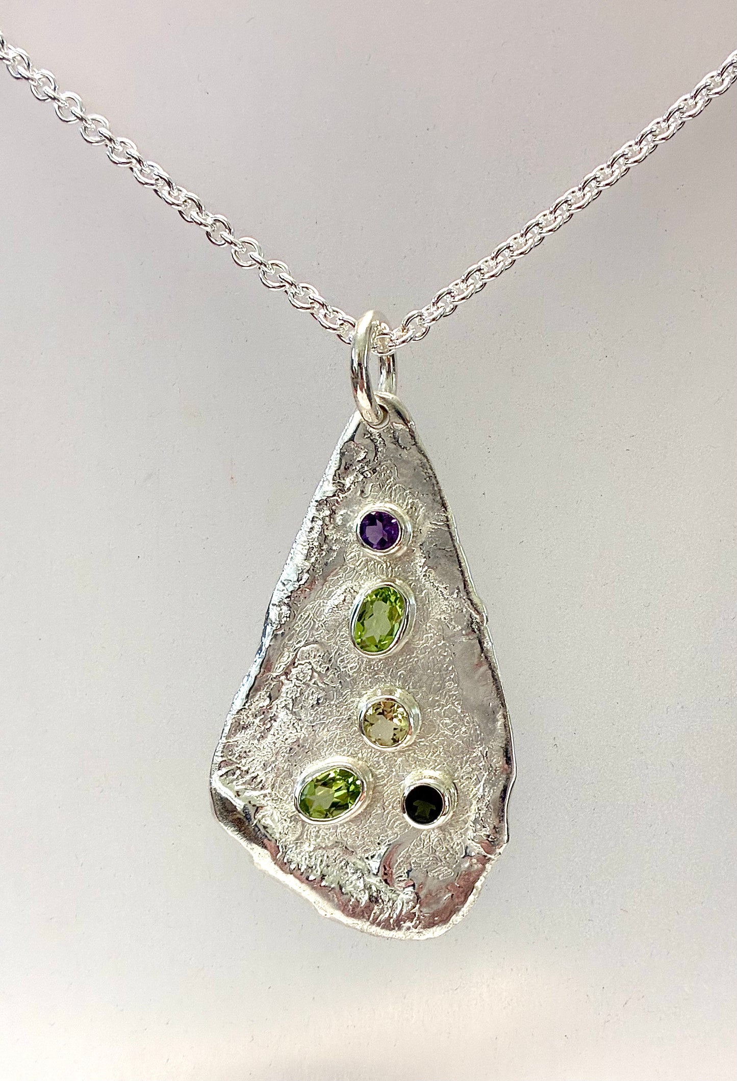 Pendant. Five stone long.