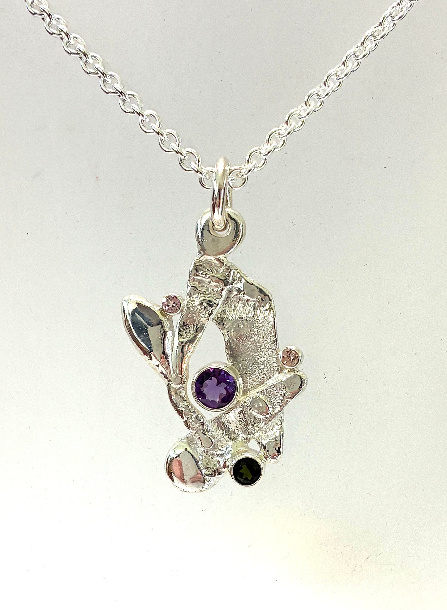 Pendant. Abstract four stone