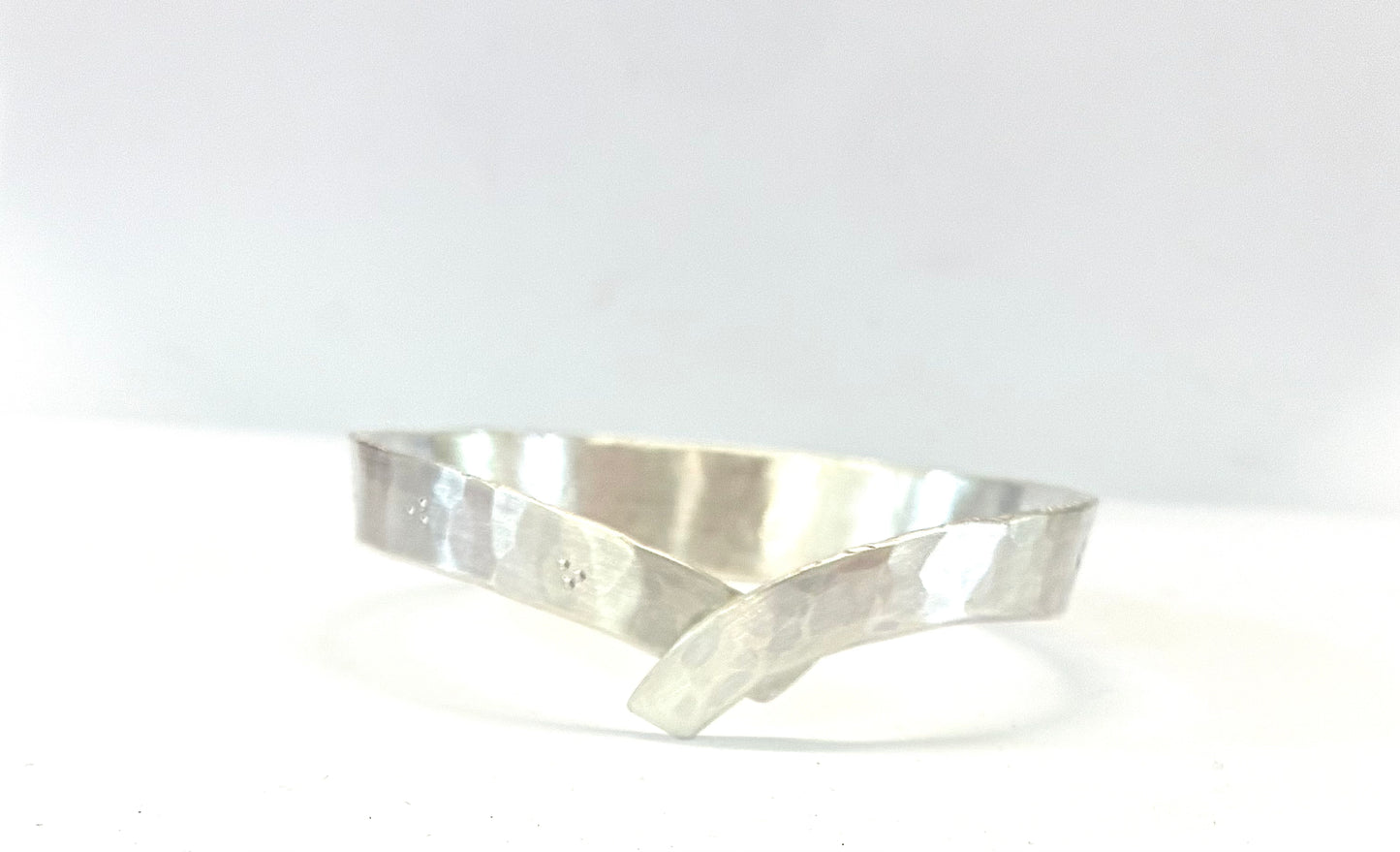 Bracelet. Cross over bangle.