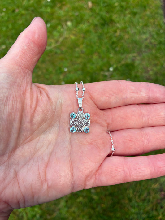 Pendant. Swiss blue topaz cross.