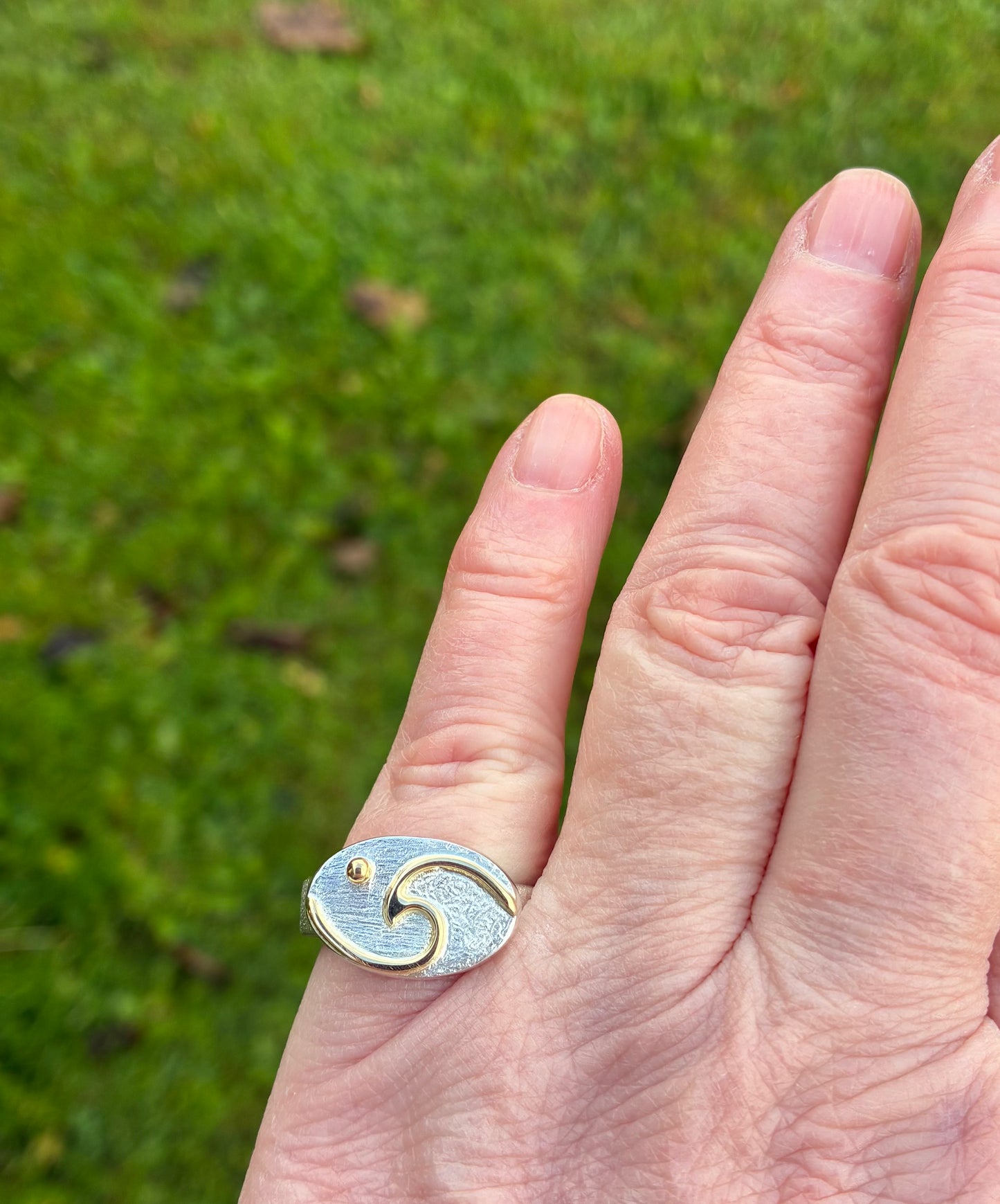 Wave with moon ring.
